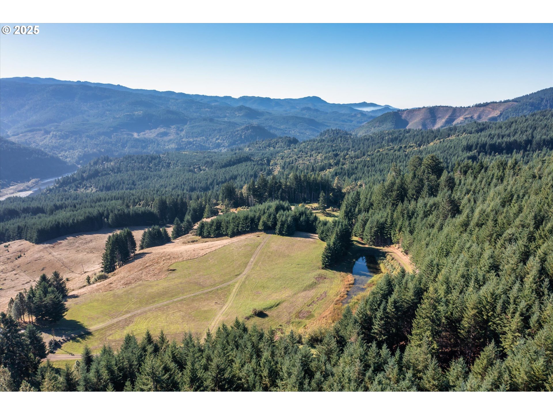32855 Miller Ranch Road Gold Beach, OR 97444 - Photo 40 of 47 a view of a backyard with green space