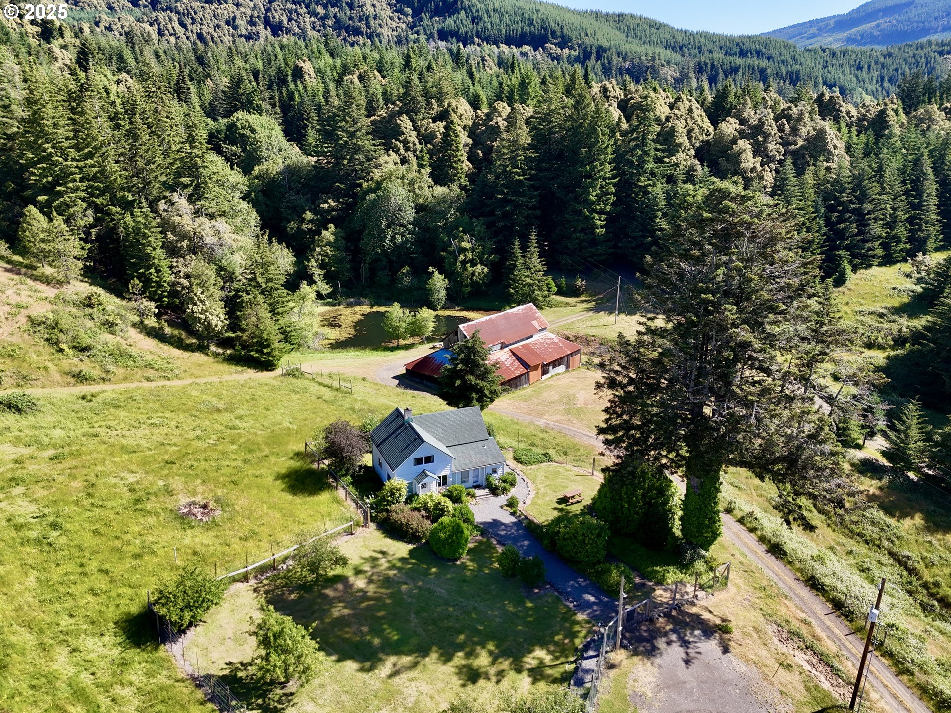 32855 Miller Ranch Road Gold Beach, OR 97444 - Photo 41 of 47 a view of a lake with a tree