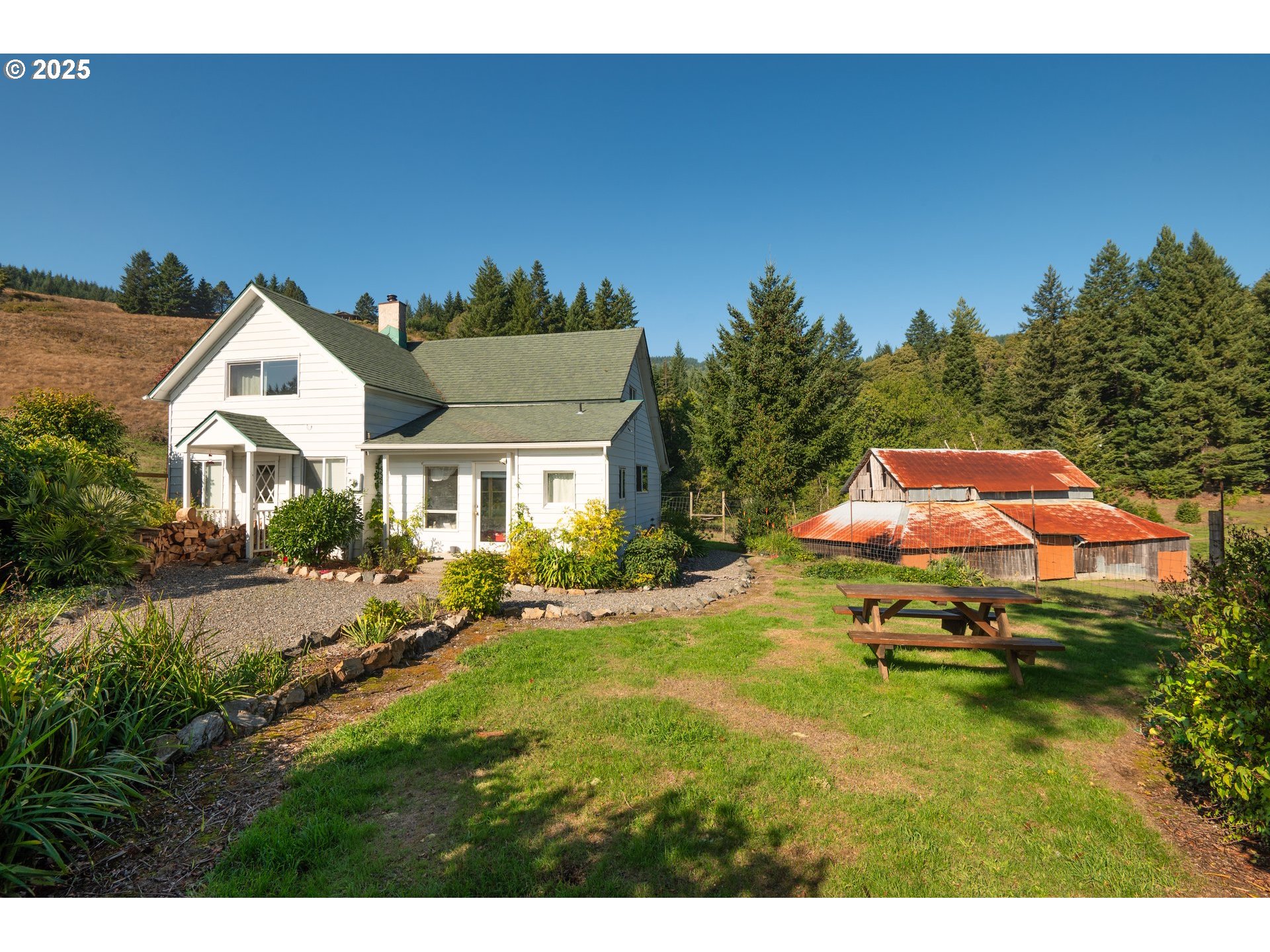 32855 Miller Ranch Road Gold Beach, OR 97444 - Photo 42 of 47 a swimming pool with outdoor seating and yard