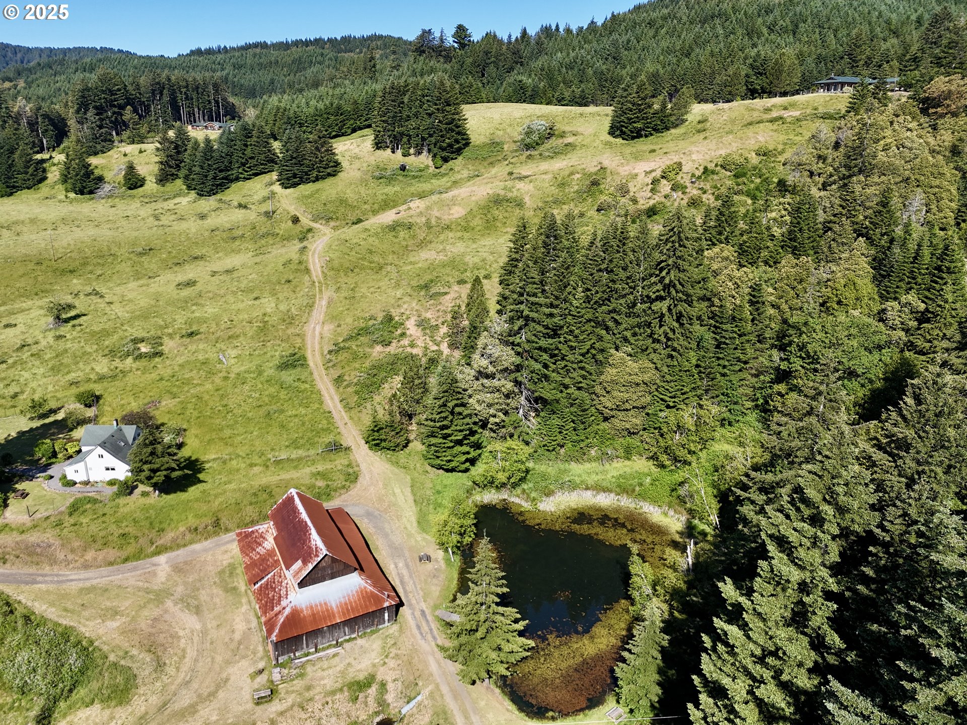 32855 Miller Ranch Road Gold Beach, OR 97444 - Photo 43 of 47 a view of a backyard of the house