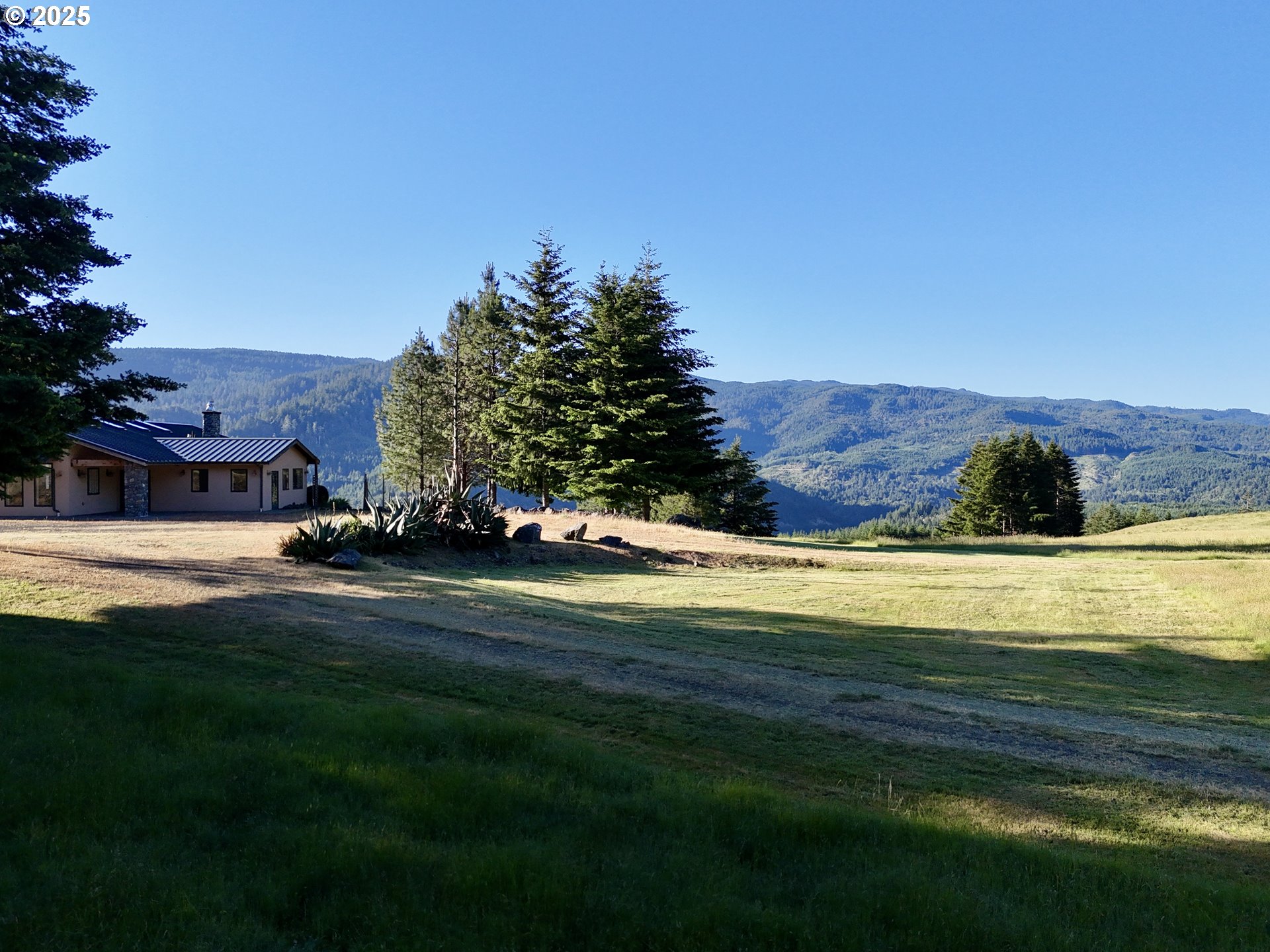 32855 Miller Ranch Road Gold Beach, OR 97444 - Photo 5 of 47 a view of a house with a big yard