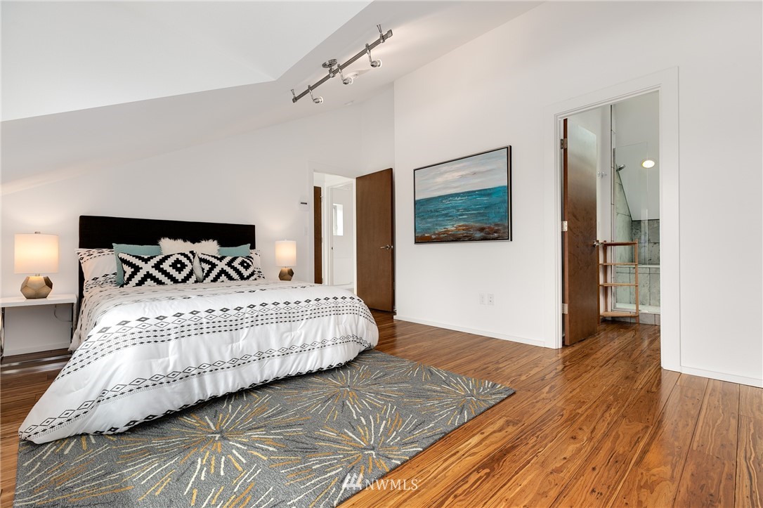 4455 Renton Avenue South Seattle, WA 98108 - Photo 16 of 25 a bedroom with a bed and a painting on the wall