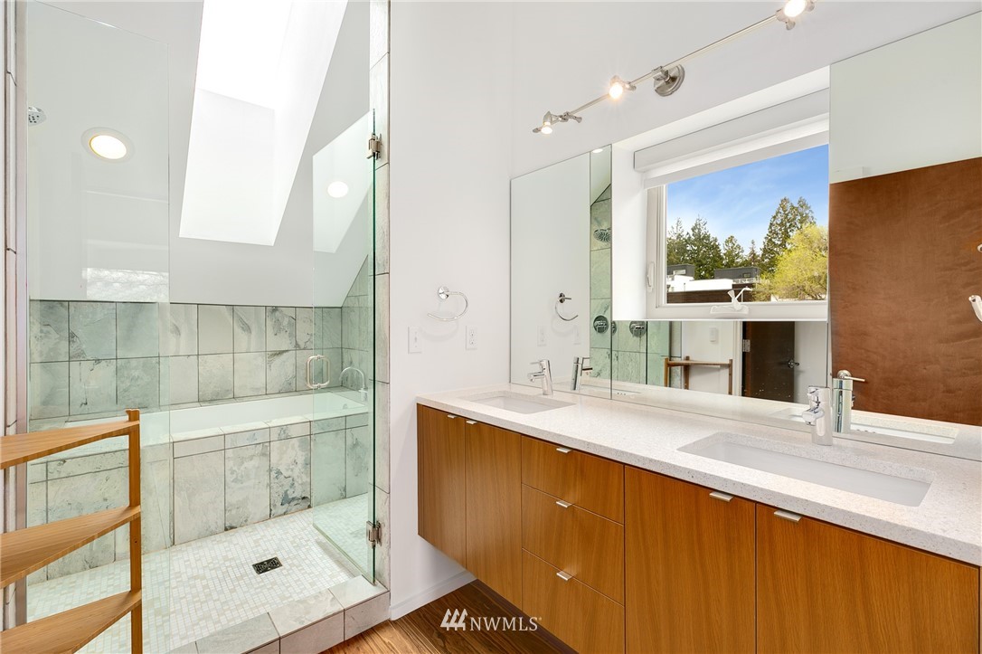 4455 Renton Avenue South Seattle, WA 98108 - Photo 17 of 25 a bathroom with a shower sink and mirror