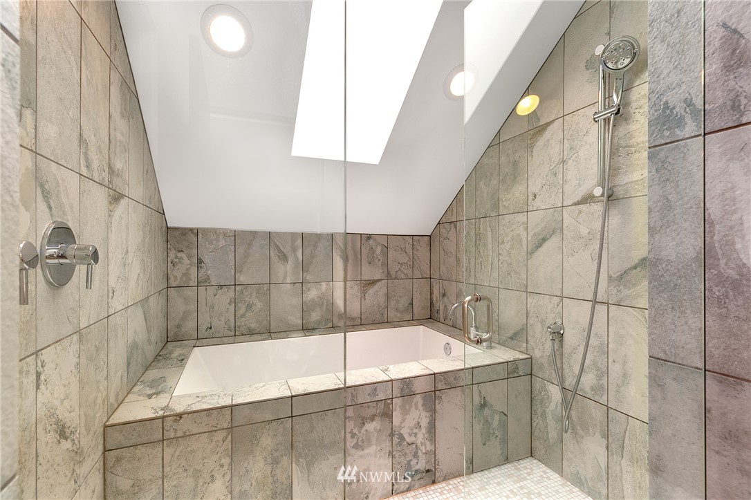 4455 Renton Avenue South Seattle, WA 98108 - Photo 18 of 25 a bathroom with a bathtub and shower