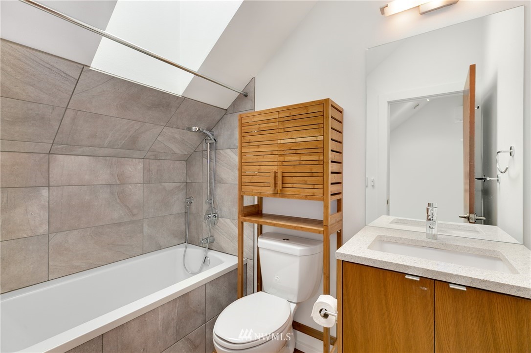 4455 Renton Avenue South Seattle, WA 98108 - Photo 19 of 25 a bathroom with a sink a toilet and bathtub