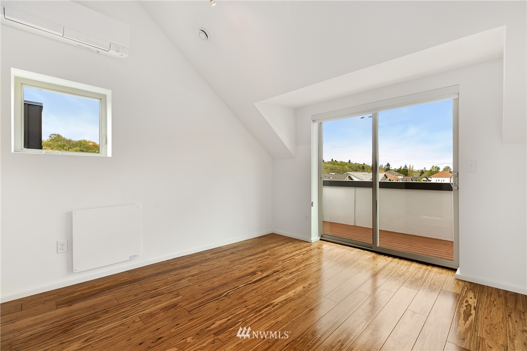 4455 Renton Avenue South Seattle, WA 98108 - Photo 21 of 25 a view of an empty room with wooden floor and a window