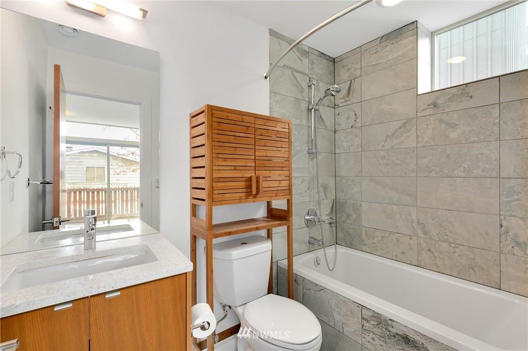 4455 Renton Avenue South Seattle, WA 98108 - Photo 24 of 25 a bathroom with a sink a toilet and bathtub
