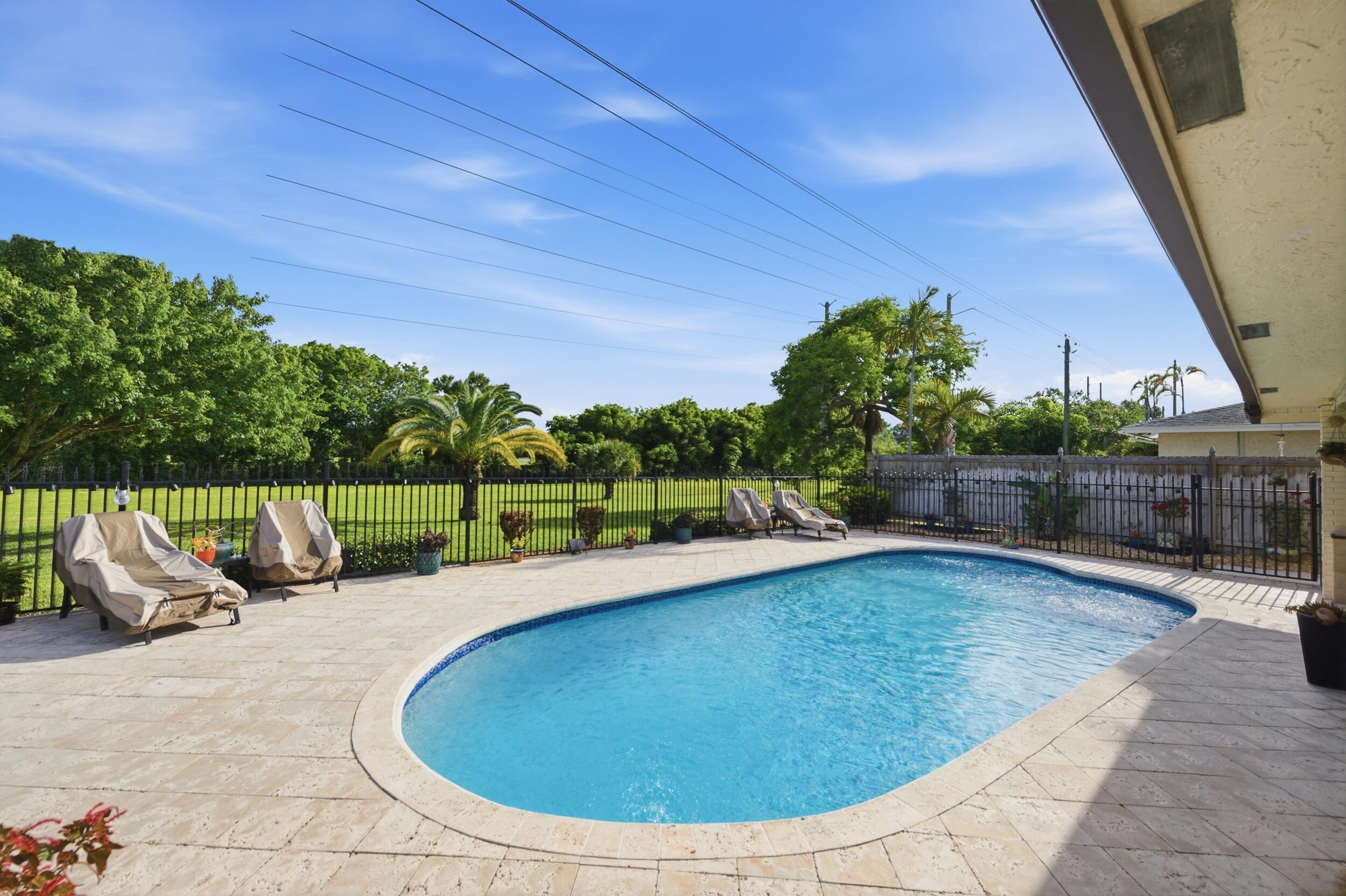 4780 Brandywine Drive Boca Raton, FL 33487 - Photo 29 of 43 a view of swimming pool having outdoor seating