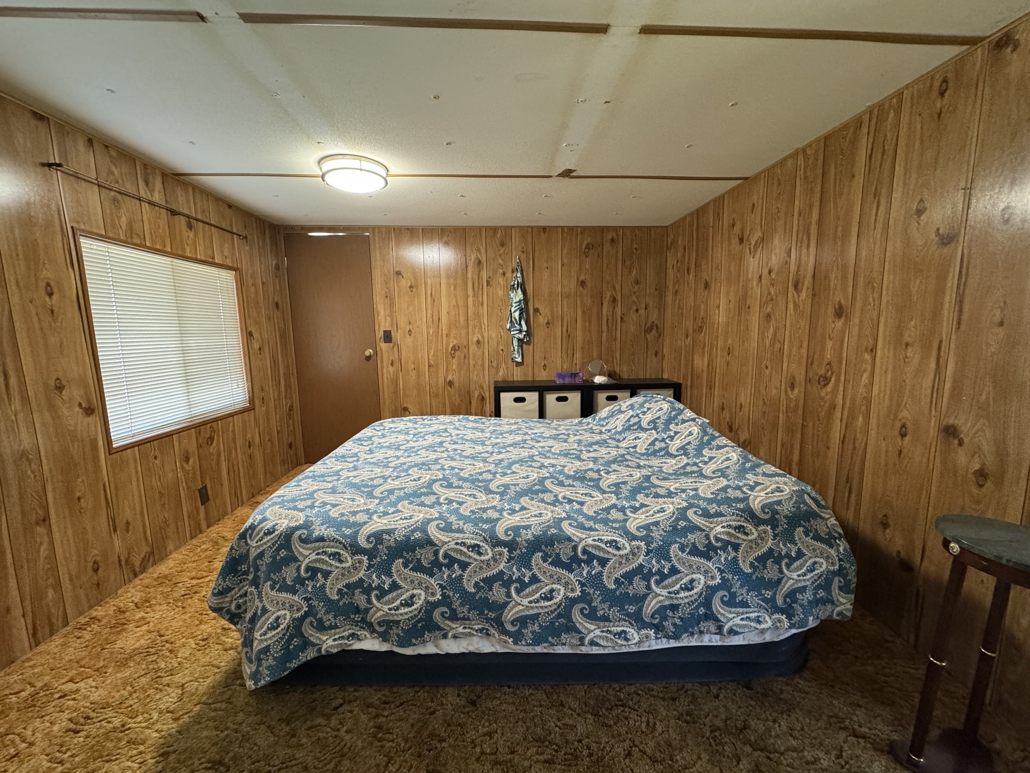 191 Forks Of The River Road Waverly, TN 37185 - Photo 50 of 59 a bed sitting in a spacious bedroom next to a bathroom