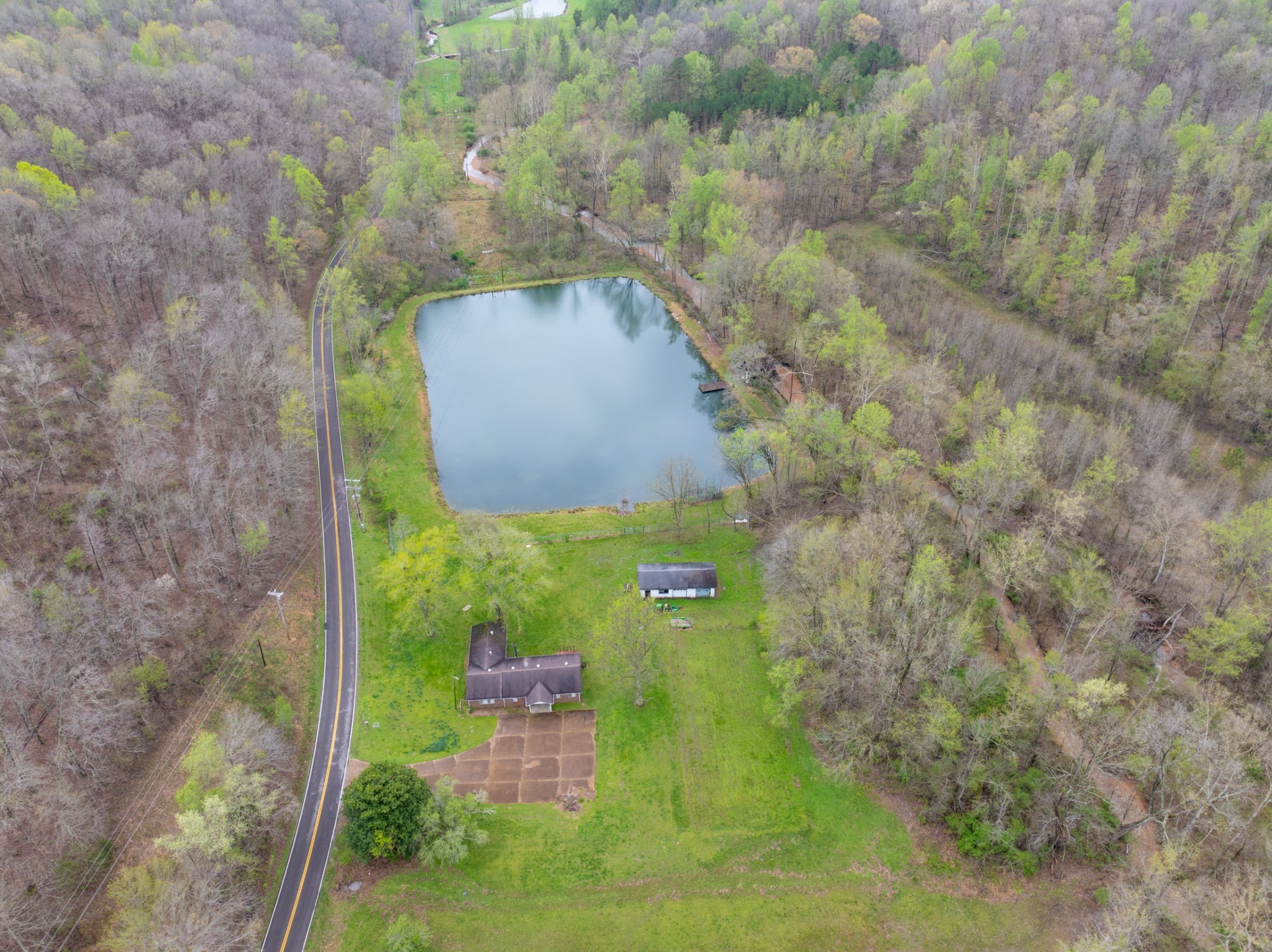 191 Forks Of The River Road Waverly, TN 37185 - Photo 5 of 59 a view of a garden with a fountain