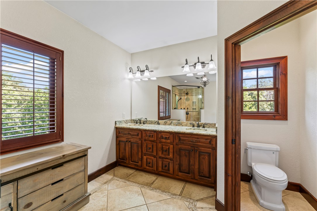 579 Terrapin Crossing Road Pickens, SC 29671 - Photo 20 of 50 Double vanity with stone counters provides ample space in this well-appointed primary bathroom with a separate water closet