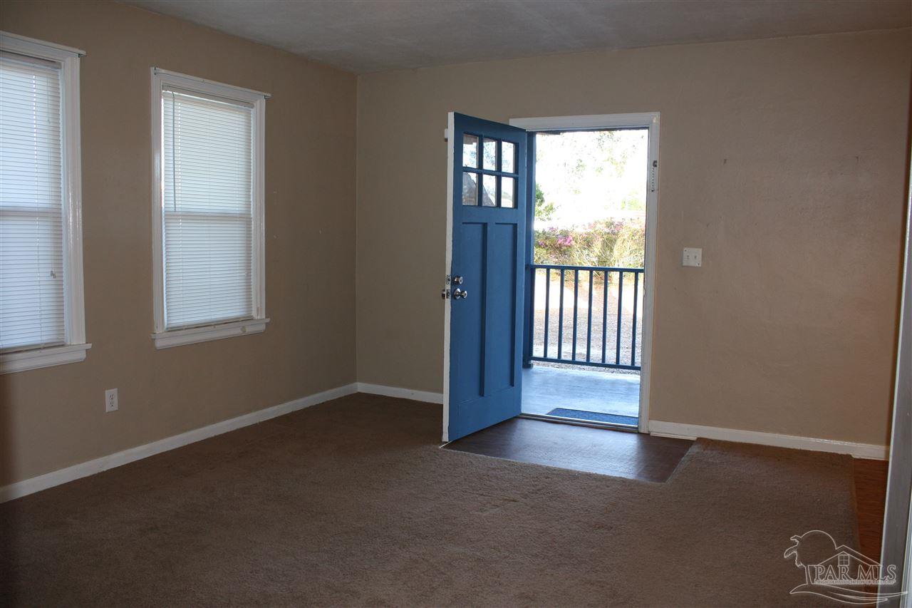 7195 Gillespie Road Milton, FL 32583 - Photo 3 of 14 an empty room with windows