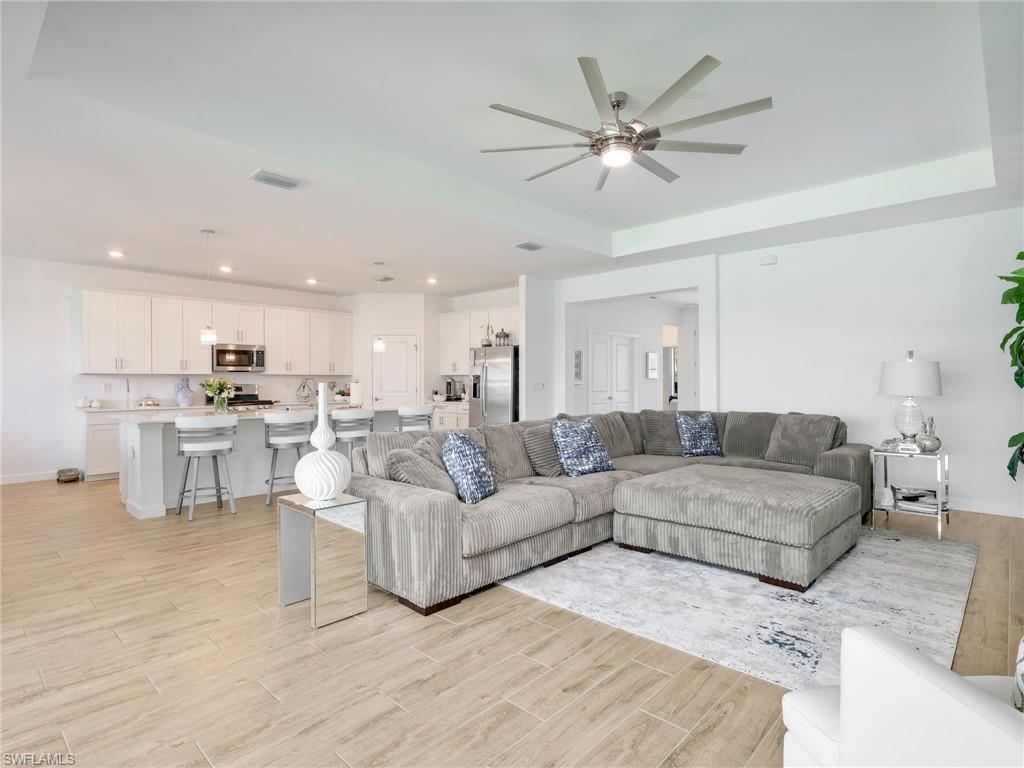 18278 Ridgeline Drive Estero, FL 33928 - Photo 12 of 45 a living room with furniture and kitchen view