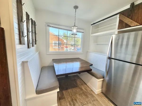 a kitchen with stainless steel appliances granite countertop a refrigerator a sink and a stove top oven