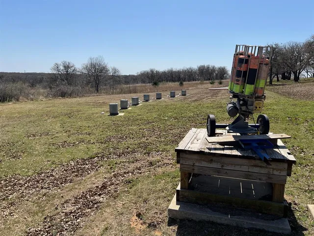 a view of a big yard with lots of green space