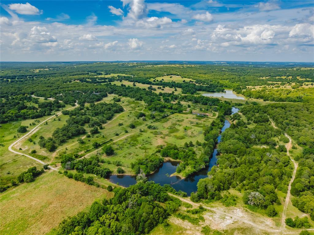 2197 Netherly Lane Forestburg, TX 76239 - Photo 36 of 40 a view of a lake with a building in the background