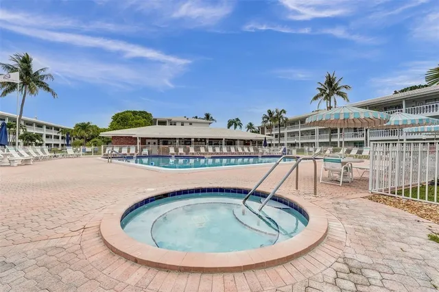 a terrace with outdoor seating and city view