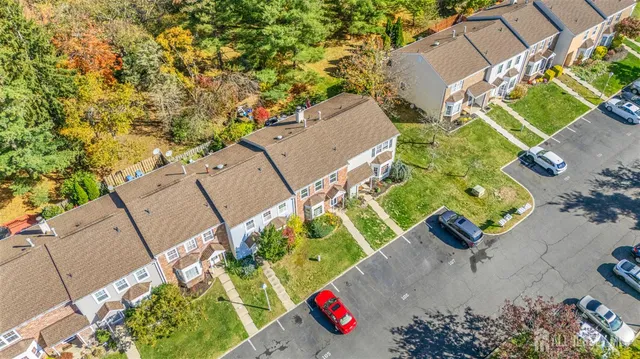 an aerial view of a house with a yard and a garden