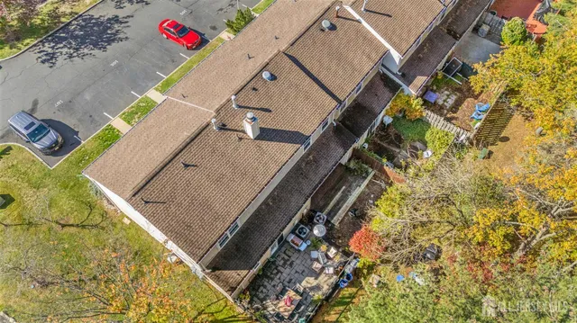 an aerial view of a house with a garden