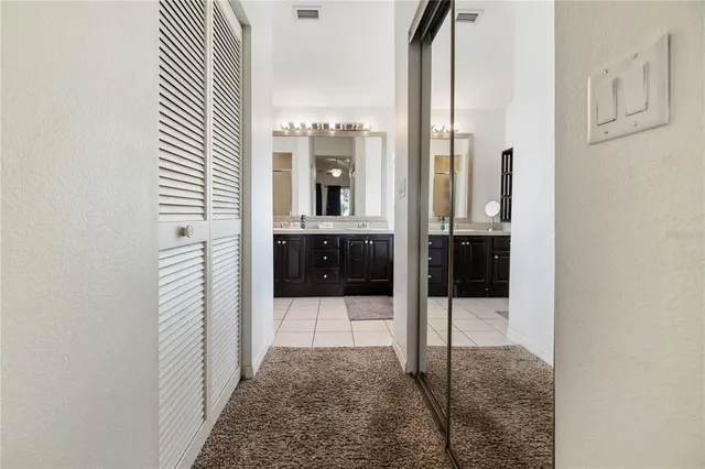a bathroom with a glass shower door