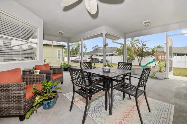 a view of a dining room with furniture window and outside view