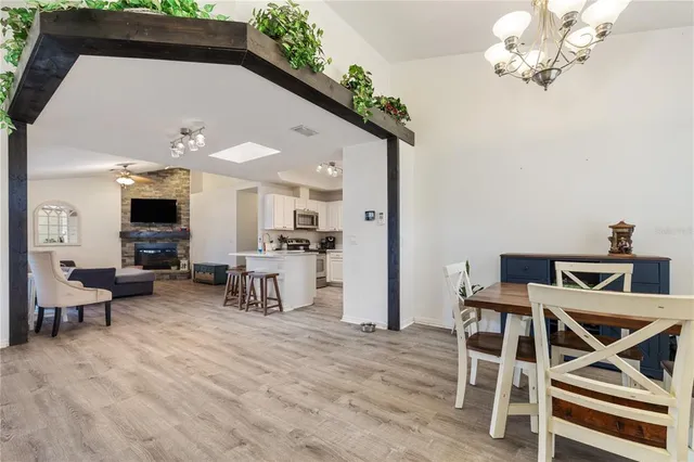 a view of a livingroom with furniture and a kitchen