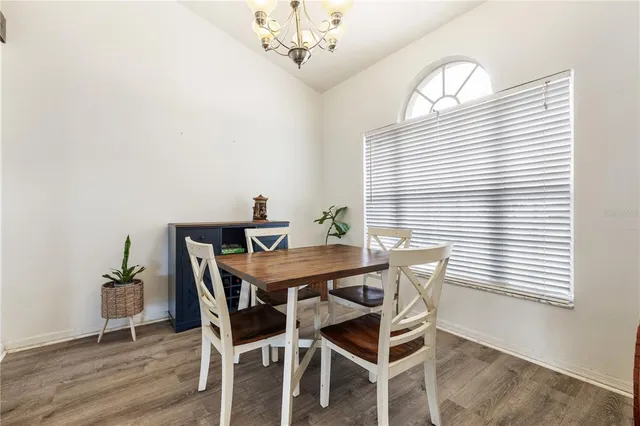 a view of a dining room with furniture and window