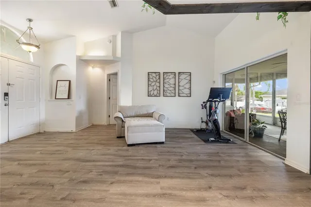 a room with furniture and a flat screen tv