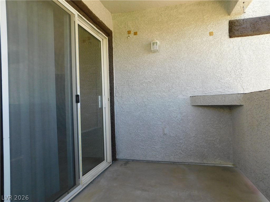 7255 West Sunset Road, Unit 2029 Las Vegas, NV 89113 - Photo 21 of 21 This outdoor patio offers a quiet retreat with sturdy concrete flooring and a sliding glass door.