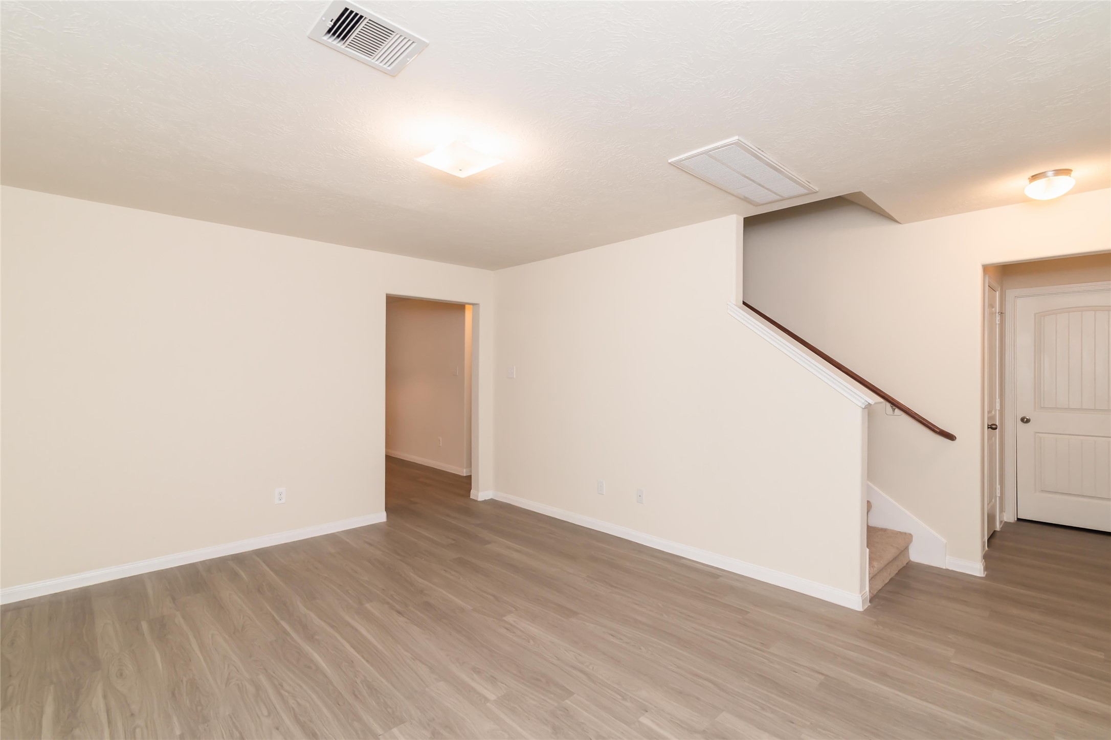 12613 Rio Nueces Lane Rosharon, TX 77583 - Photo 4 of 10 a view of an empty room with wooden floor