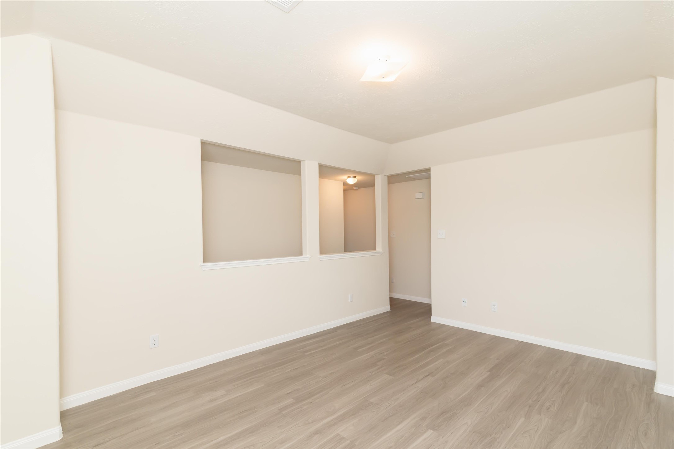 12613 Rio Nueces Lane Rosharon, TX 77583 - Photo 9 of 10 a view of an empty room with wooden floor