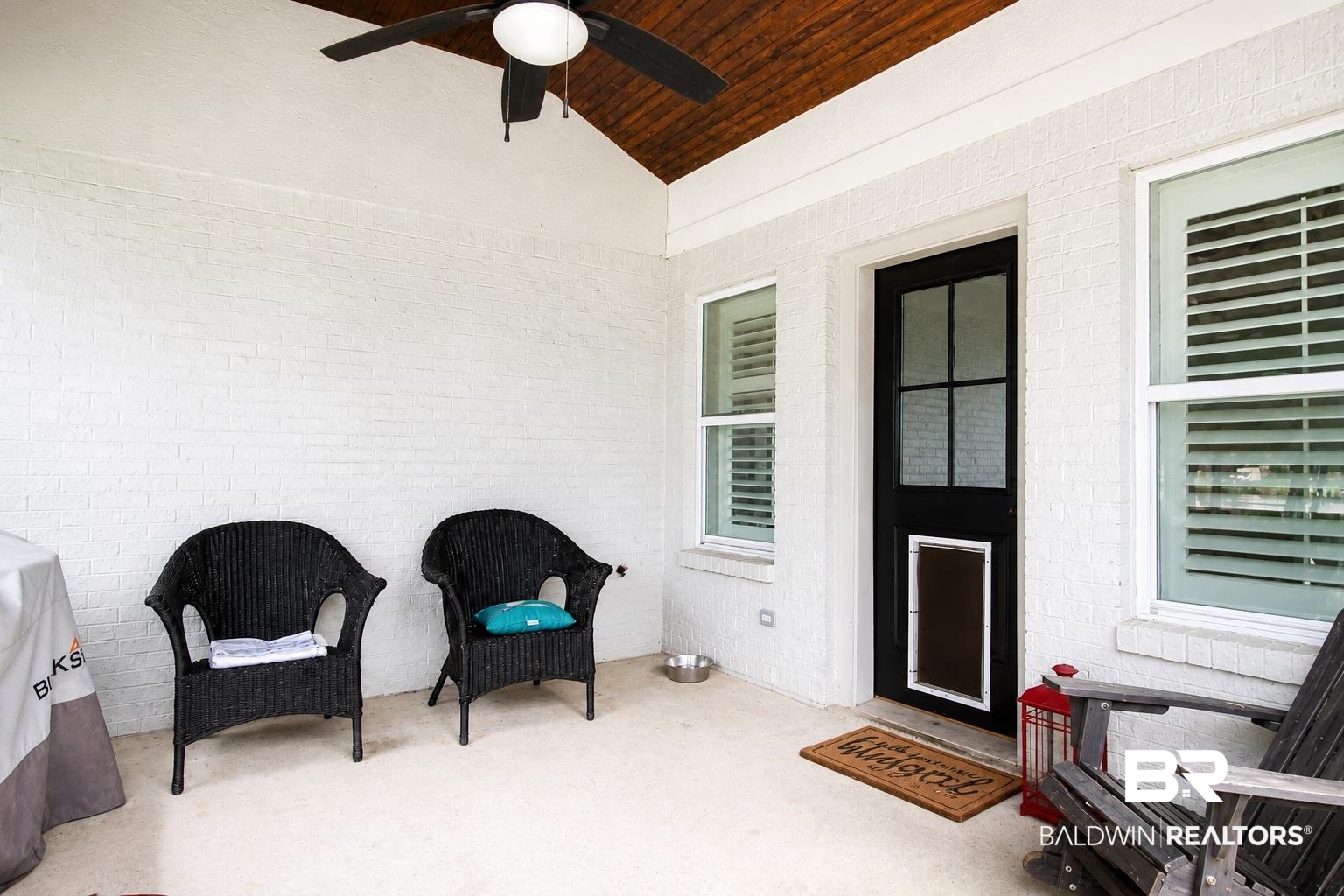 9825 Wolf Creek Ridge Elberta, AL 36530 - Photo 49 of 76 Covered patio featuring a painted brick exterior, a wood-paneled ceiling, and a ceiling fan