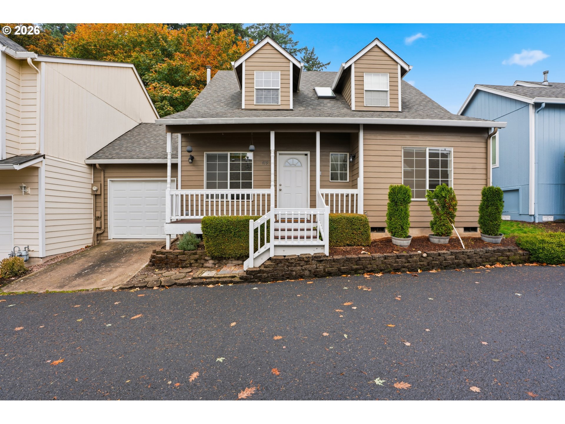 419 Northeast 7th Avenue Camas, WA 98607 - Photo 1 of 27 a front view of a house with a garden and porch
