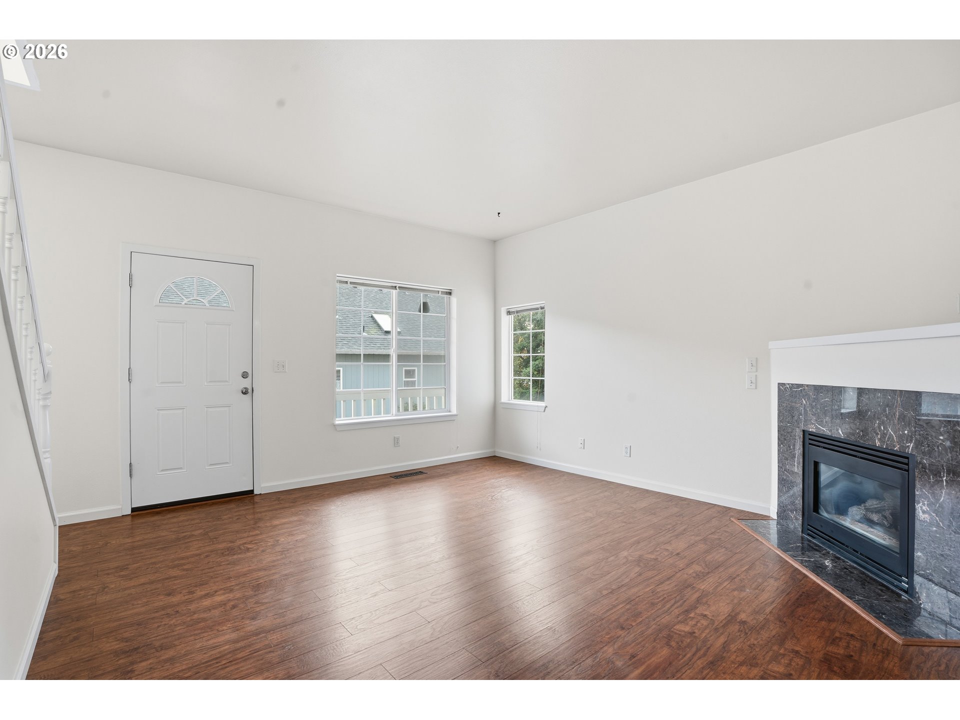 419 Northeast 7th Avenue Camas, WA 98607 - Photo 14 of 27 a view of an empty room with wooden floor fireplace and a window