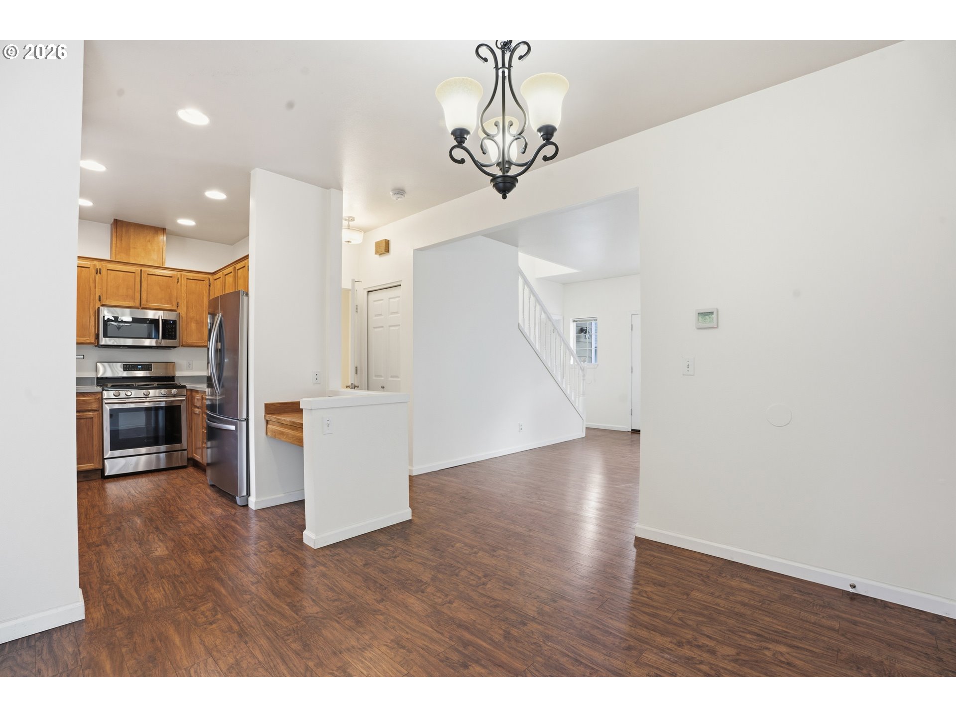 419 Northeast 7th Avenue Camas, WA 98607 - Photo 5 of 27 a view of a living room and kitchen with wooden floor