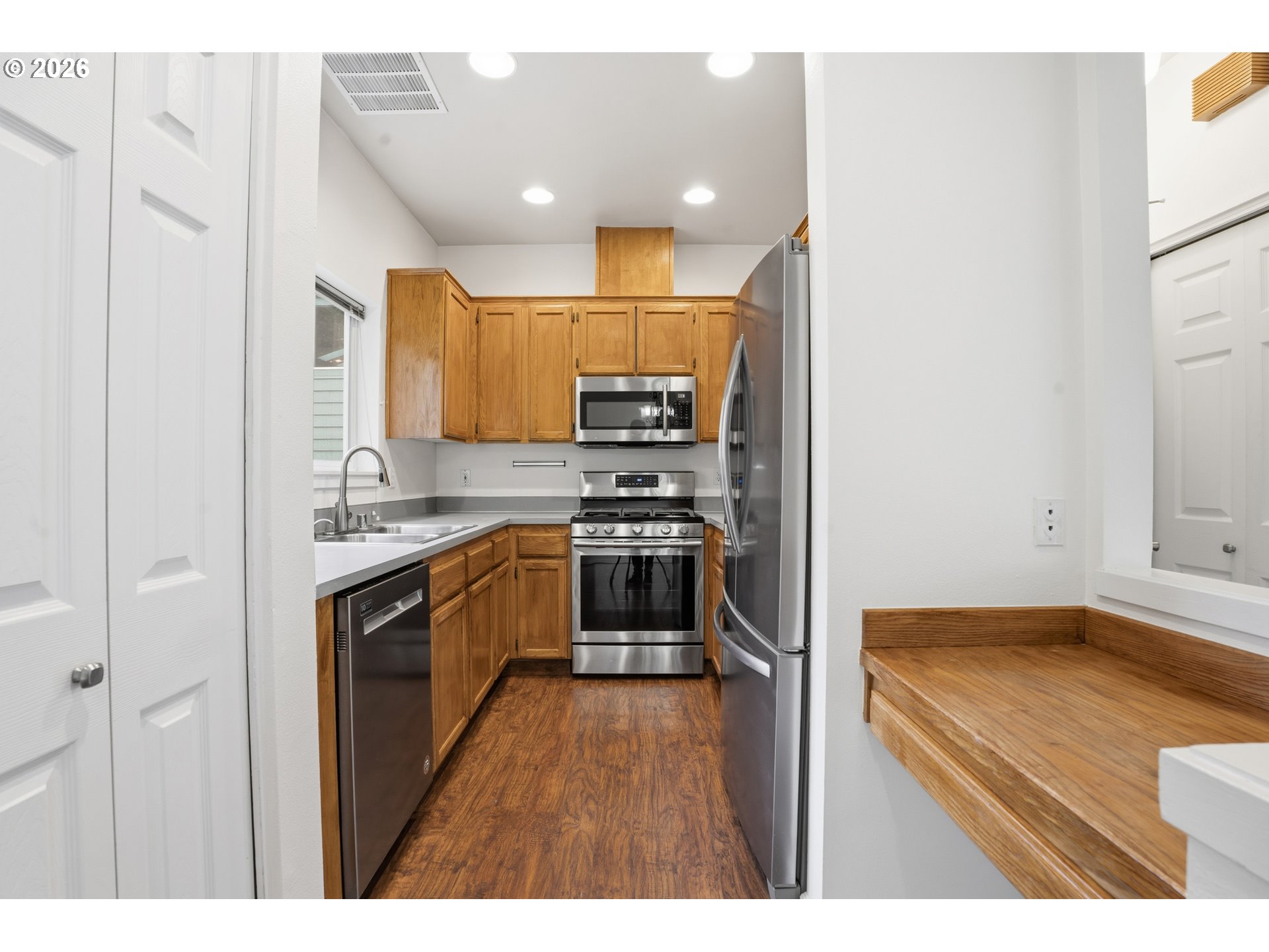 419 Northeast 7th Avenue Camas, WA 98607 - Photo 9 of 27 a kitchen with kitchen island a counter top space stainless steel appliances and cabinets