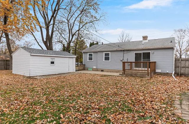 a backyard of a house with large trees