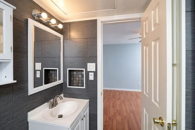 a bathroom with a toilet a sink and bathtub