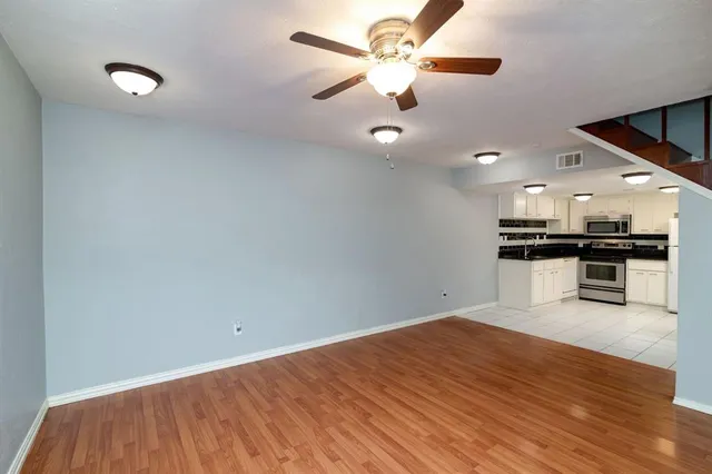 a kitchen with cabinets and steel stainless steel appliances