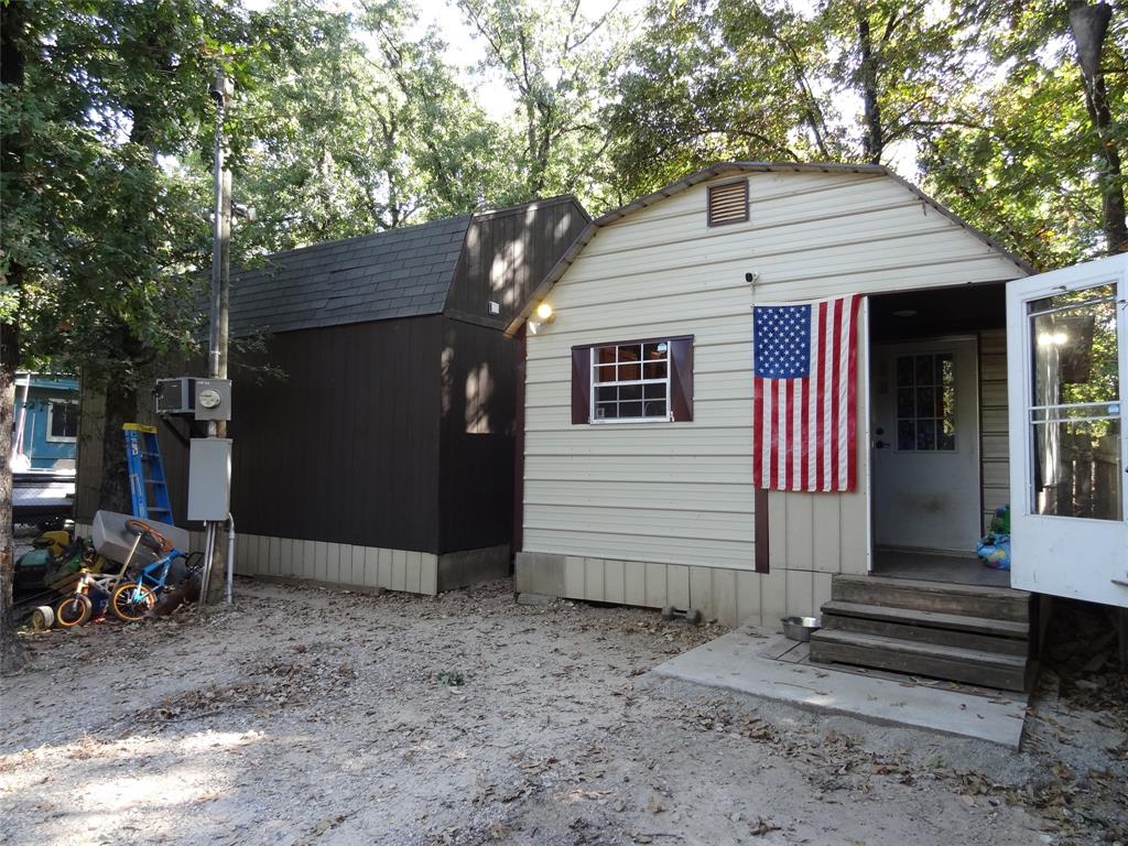 126 Deer Run Road Mabank, TX 75156 - Photo 17 of 20 a view of a house with a yard