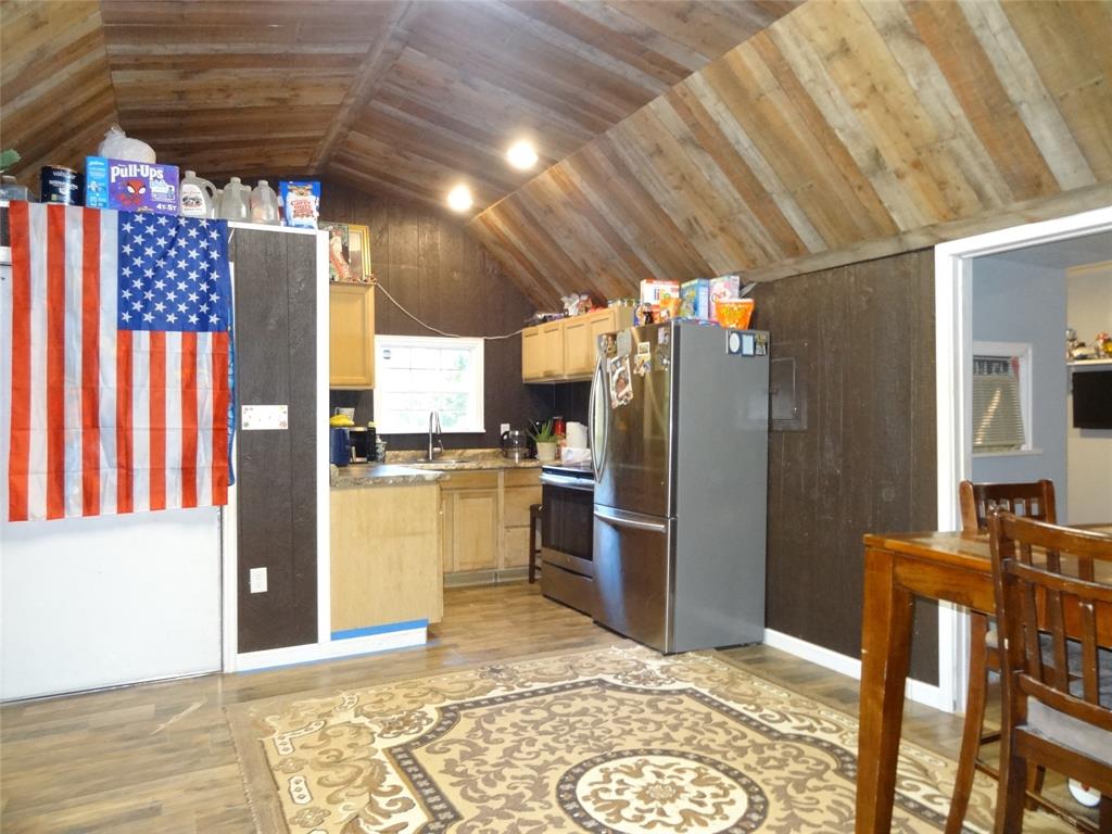 126 Deer Run Road Mabank, TX 75156 - Photo 2 of 20 a kitchen with refrigerator and cabinets