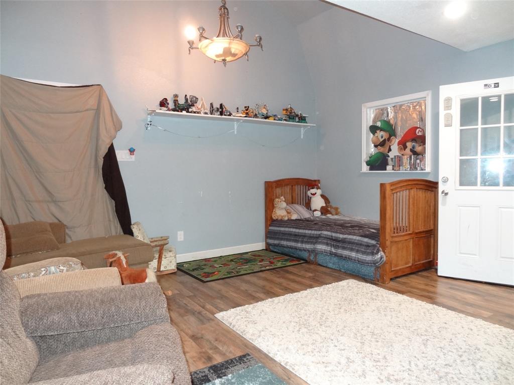 126 Deer Run Road Mabank, TX 75156 - Photo 4 of 20 a living room with furniture and a flat screen tv