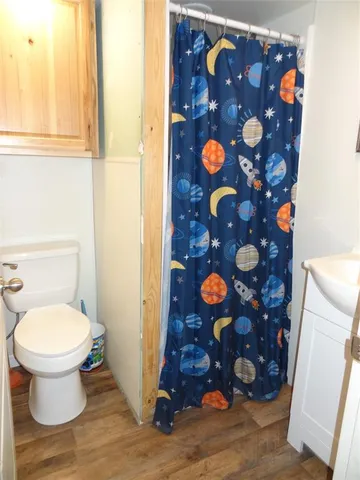 a bathroom with a toilet and a sink