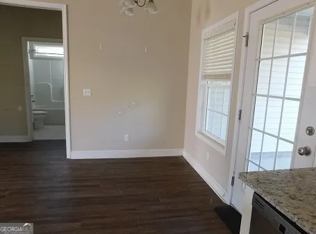 a view of a kitchen from the hallway