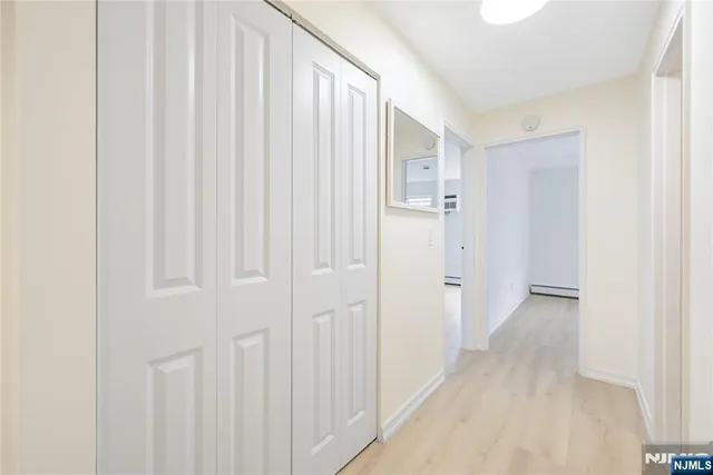 a view of a hallway with closet area