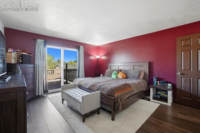 a bedroom with a bed and a couch