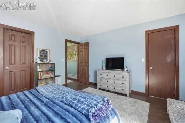 a bedroom with a bed and furniture