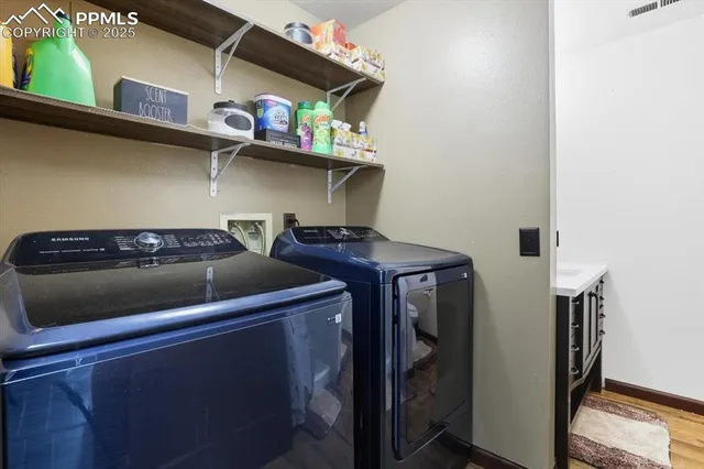 a view of storage and utility room with racks on the wall