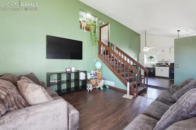 a living room with furniture and a flat screen tv