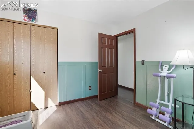 a view of hallway with wooden floor